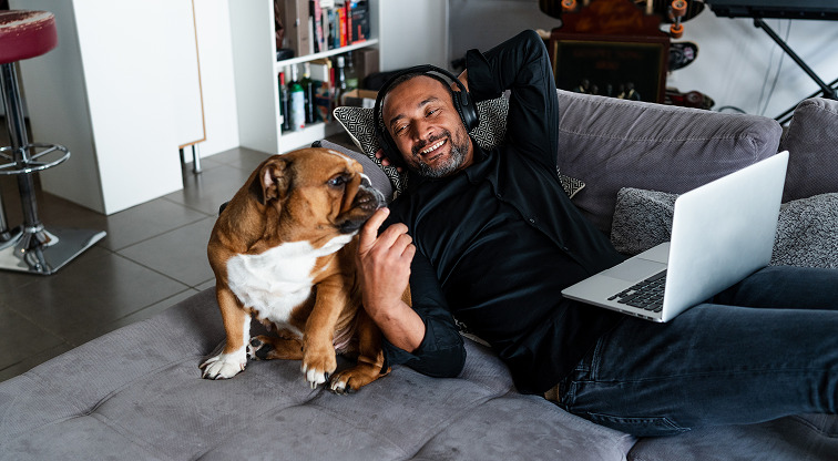 Man with his dog on sofa